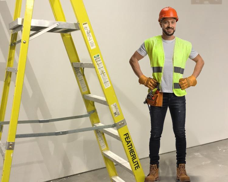 Construction worker in a safety vest next to a Featherlite ladder, highlighting safety and quality.