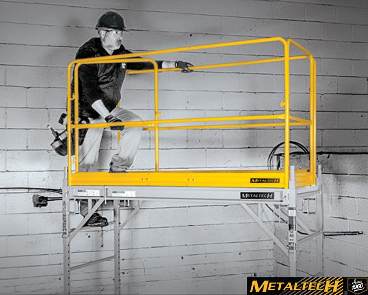 A Metaltech worker stands on a yellow safety platform, highlighting safety measures in a construction or industrial setting.