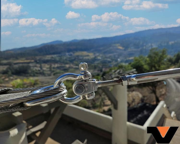 clasp holding a wire and steel cables that is adjustable and in a scenic vista 